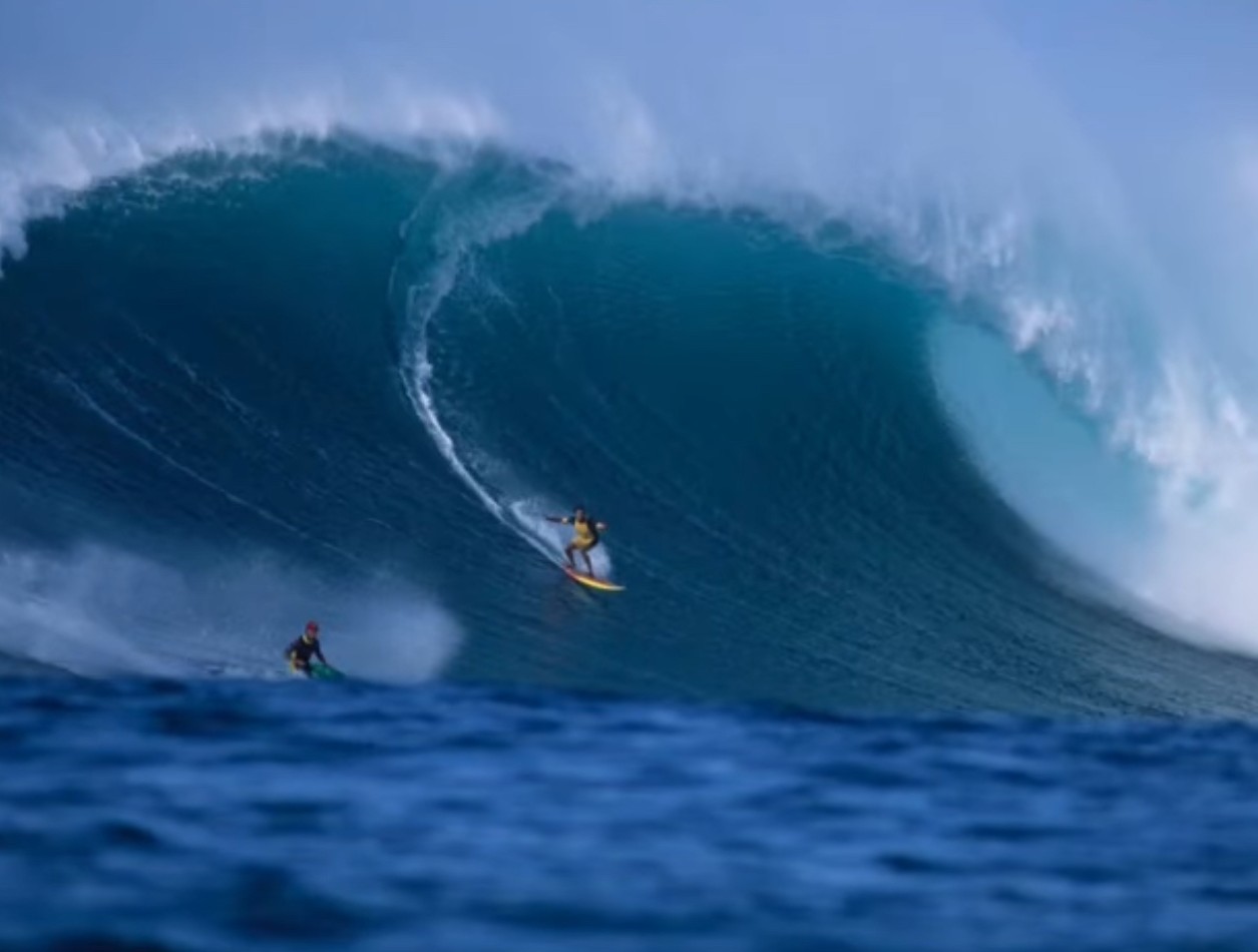 milton_wilis_big_wave_surfing Big-wave surfer navigating powerful ocean current